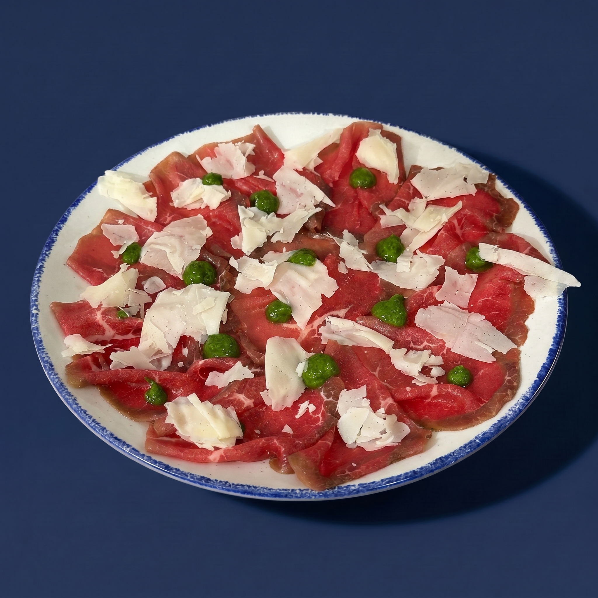 Carpaccio, rucola e raspadura